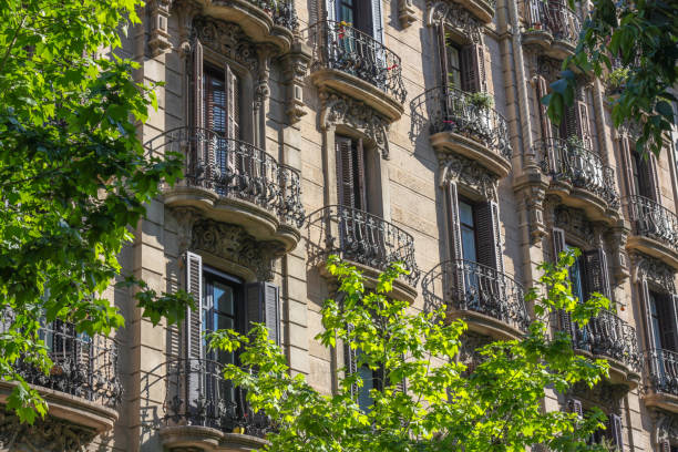 istock Apartment facade with windows and balconies in Barcelona, Spain 804017576