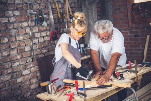 istock Female craftsman,in her workshop with her father 804017582