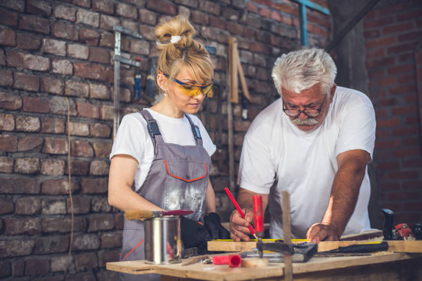 istock Female craftsman,in her workshop with her father 804024890