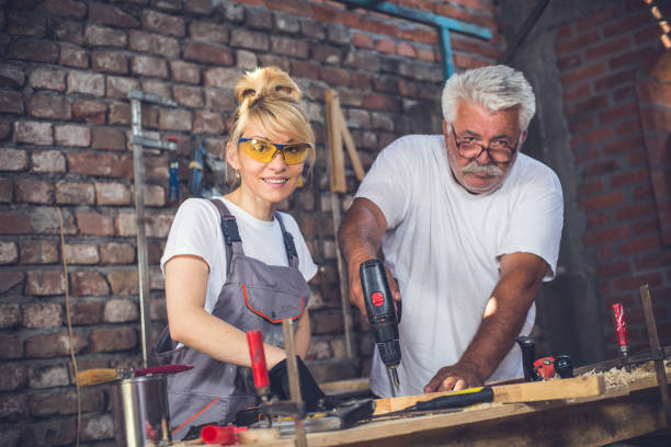 istock Female craftsman,in her workshop with her father 804025078