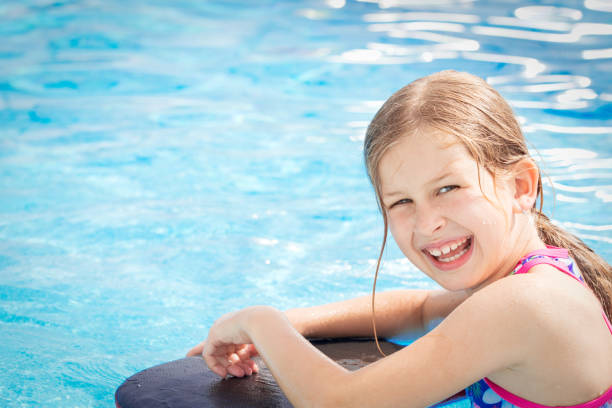 istock Girl having fun in swimming pool 804025314
