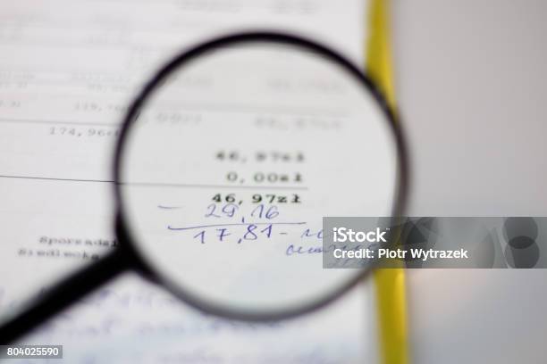 Documents Calculations And Calculations By Magnifying Glass Stock Photo