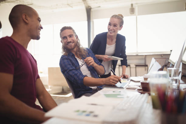 istock Happy business colleagues working together at creative office 804030112