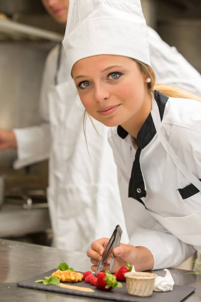 istock Chef decorating gourmet dessert in commercial kitchen 804030250