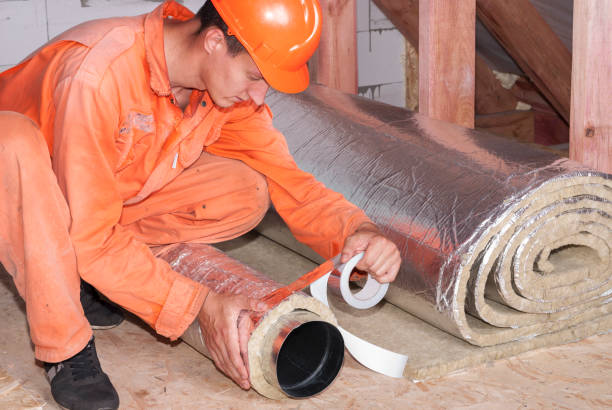 installer wraps the air duct stock photo