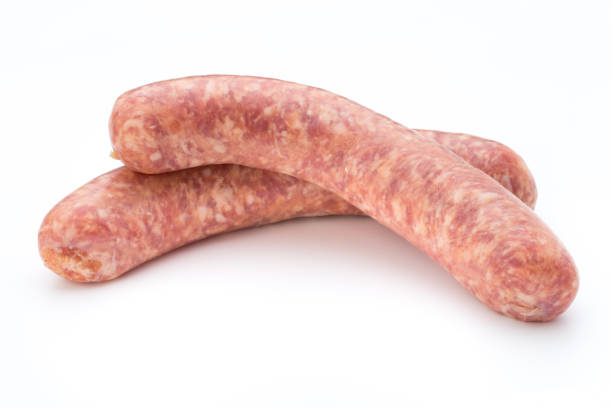 istock Raw sausage with parsley leaf isolated on white background. 804036832