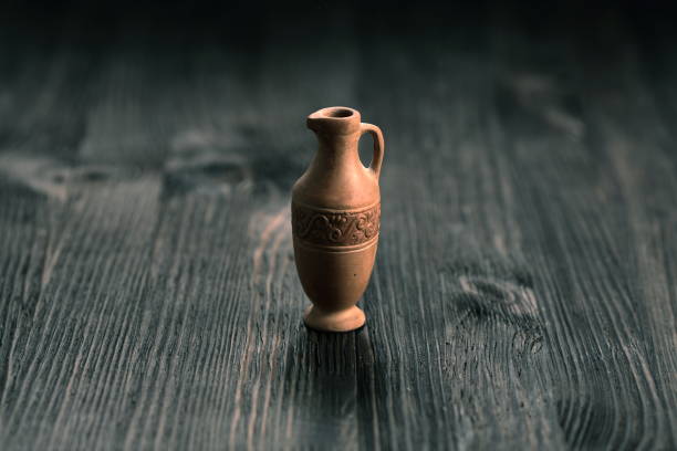 istock Small clay jug on a wooden table 804040494