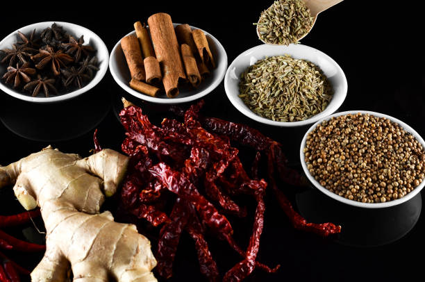 istock Mixed spice ginger, chilli, lemongrass, fenugreek, aniseed, anise, cinnamon over black background 804049804