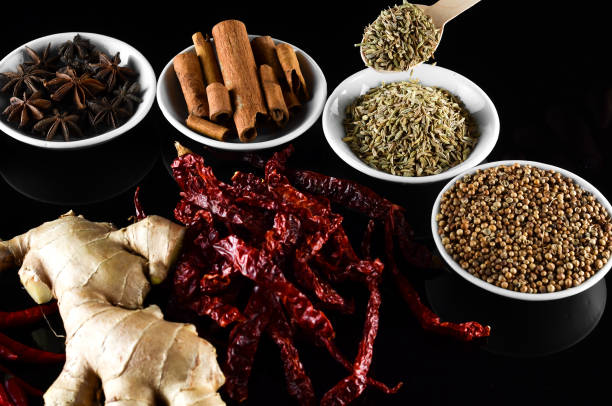 istock Mixed spice ginger, chilli, lemongrass, fenugreek, aniseed, anise, cinnamon over black background 804049998