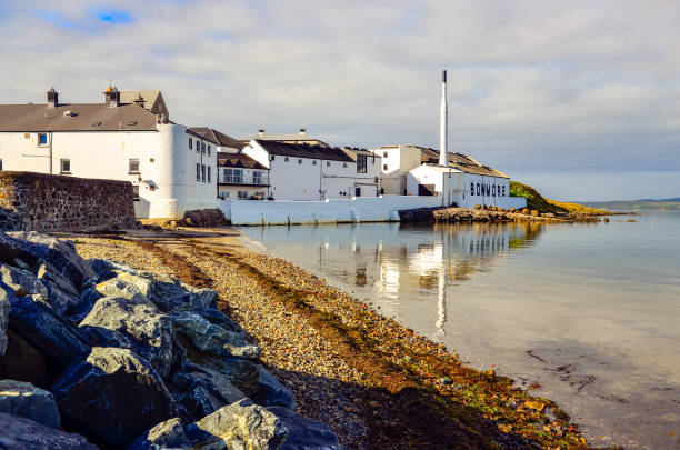 Scenic view of Bowmore distillery, Island of Islay, United Kingdom Islay: Scenic view of Bowmore distillery, Island of Islay, United Kingdom bowmore whisky stock pictures, royalty-free photos & images