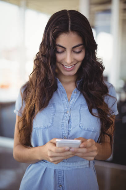 istock Pretty businesswoman using mobile phone 804056982