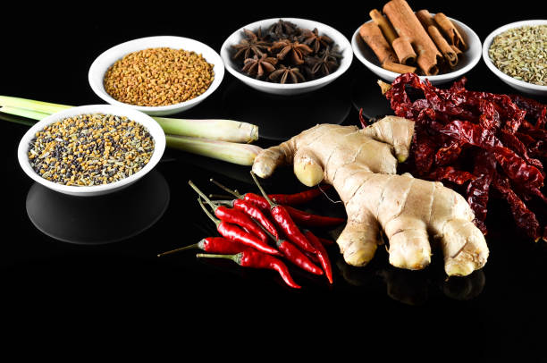 istock Mixed spice ginger, chilli, lemongrass, fenugreek, aniseed, anise, cinnamon over black background 804061412