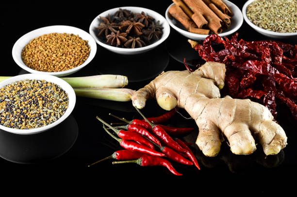 istock Mixed spice ginger, chilli, lemongrass, fenugreek, aniseed, anise, cinnamon over black background 804061856