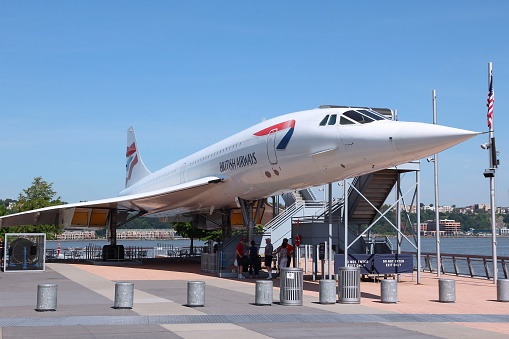 People visit Concorde at Intrepid Sea, Air and Space Museum in New York. The museum is located onboard USS Intrepid, retired aircraft carrier.