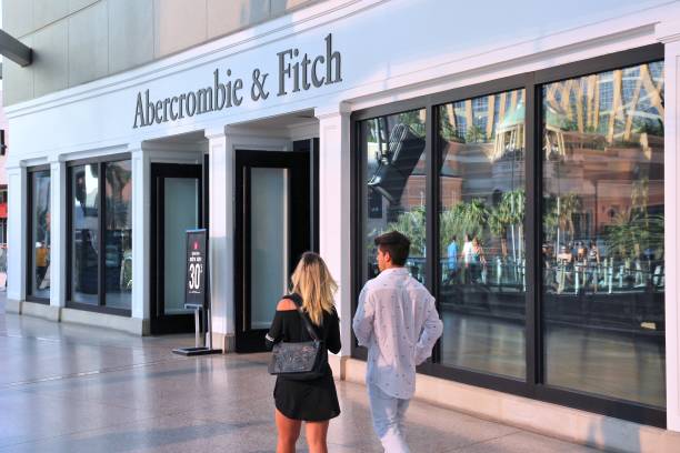 Abercrombie and Fitch People walk by Abercrombie and Fitch store in Las Vegas. Abercrombie and Fitch dates back to 1892 and had 1006 locations as of 2014. abercrombie fitch stock pictures, royalty-free photos & images