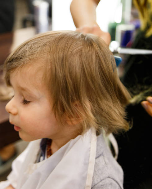 The first haircut Boy gets a new haircut körperpflege stock pictures, royalty-free photos & images