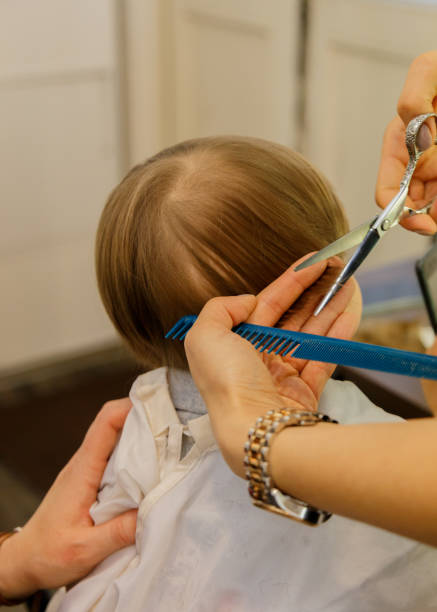 The first haircut Boy gets a new haircut körperpflege stock pictures, royalty-free photos & images