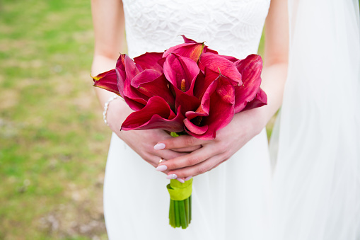 Beautiful wedding bouquet of flowers in bride’s hands