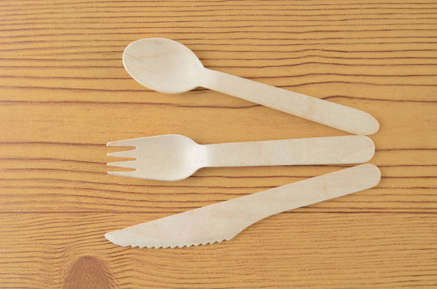 istock Wooden spoon, fork and knive over wooden background 804087558