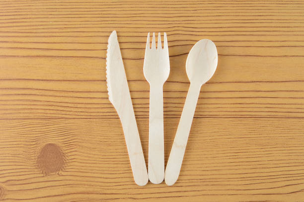 istock Wooden spoon, fork and knive over wooden background 804090172