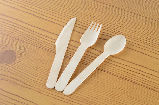 istock Wooden spoon, fork and knive over wooden background 804090700