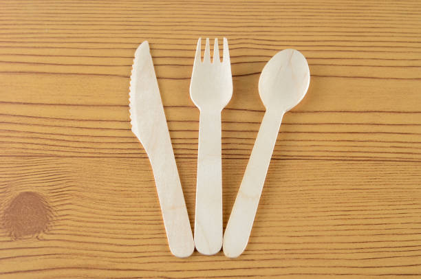 istock Wooden spoon, fork and knive over wooden background 804092928