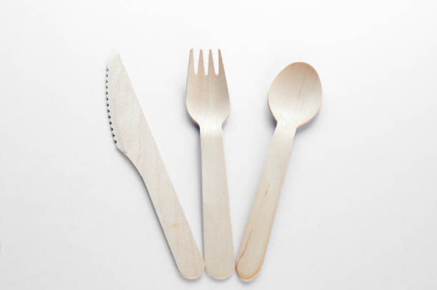 istock Wooden spoon, fork and knive over white background 804095754