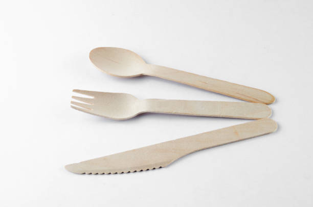 istock Wooden spoon, fork and knive over white background 804098030