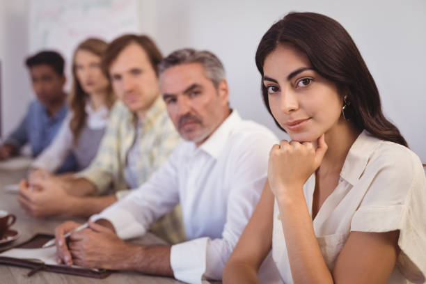 istock Business people sitting in conference room 804098106