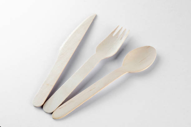 istock Wooden spoon, fork and knive over white background 804098224