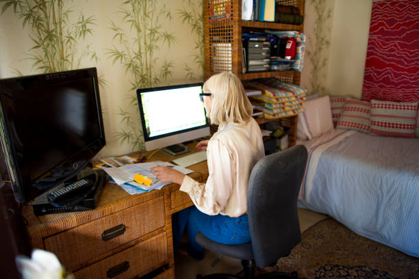 istock Mature senior woman working from home 804145622