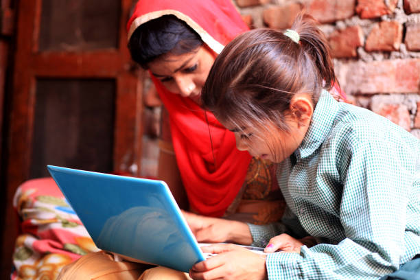istock Indian women using laptop at home 804145934