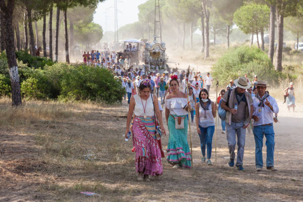 El Rocio, Spain - June 1, 2017: Pilgrims in traditional spanish dress on the road to El Rocio during the Romeria 2017. Province of Huelva, Almonte, Andalusia, Spain