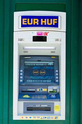 Automatic Teller Machine  at corner of street in Budapest during summer day