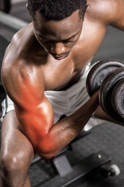 istock Dedicated shirtless male athlete doing excercise with dumbbells 804154182