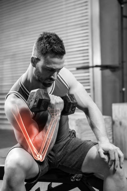 istock Young sportsman doing excercise with dumbbells 804154220