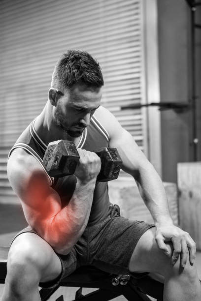 istock Young male athlete doing excercise with dumbbells 804154236