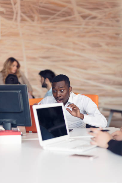 istock Handsome African American looking at the screen with serious face expression 804162716