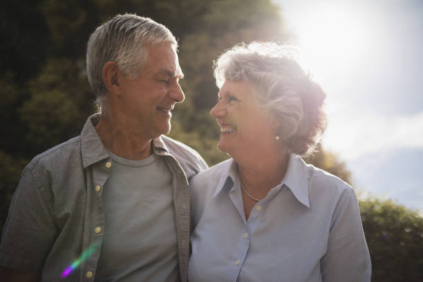 istock Smiling senior couple looking at each other on sunny day 804168144