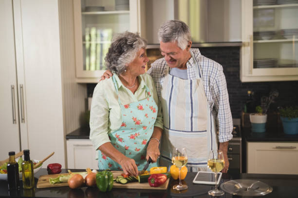 istock Senior couple preparing food in kitchen 804168590