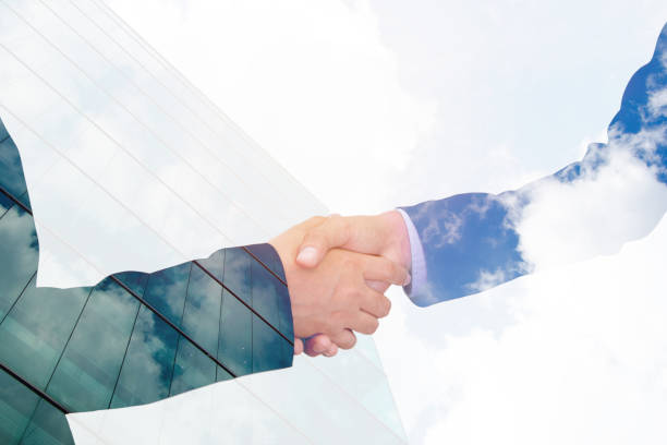 istock business handshake with city background, Double exposure style 804194238
