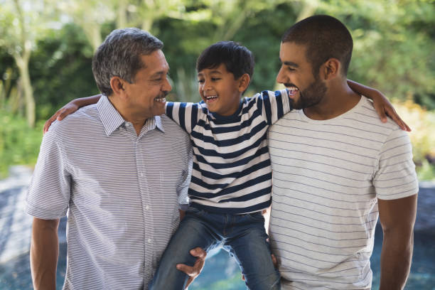 istock Happy multi-generation family standing at porch 804202382