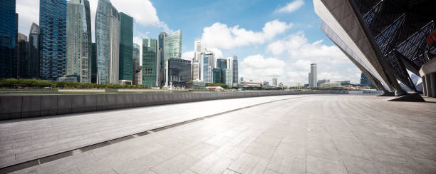 pavimento vuoto con edifici moderni - singapore street business sky foto e immagini stock
