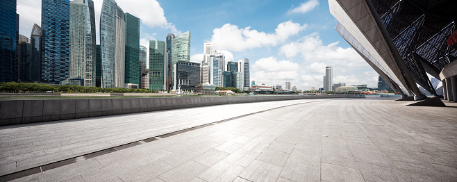 empty sidewalk with modern buildings in singapore