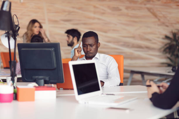 istock Handsome African American looking at the screen with serious face expression 804238900