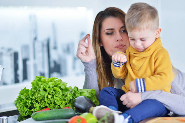 istock Mother and child preparing lunch from fresh veggies 804246826