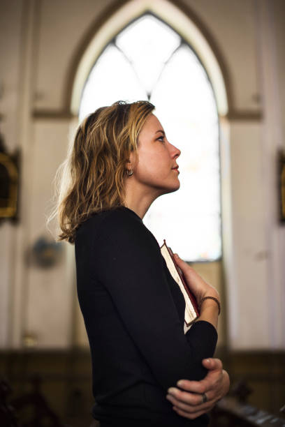 istock Woman Standing Church Religion Concept 804253280