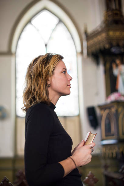 istock Woman Standing Church Religion Concept 804253328