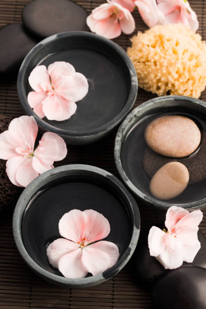 istock Spa still life, with pink flowers, stones and water 804253542