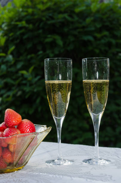 istock Two glasses with sparkling wine and strawberries 804263308